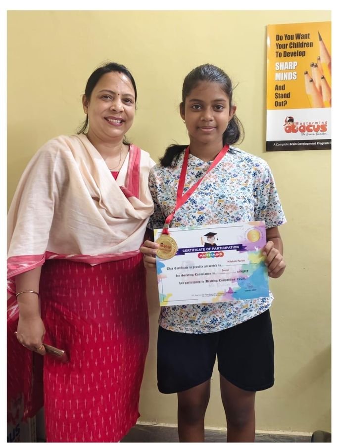 Teacher and student with drawing competition medal